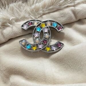 CHANEL Silver Brooch with Multicolor Stars